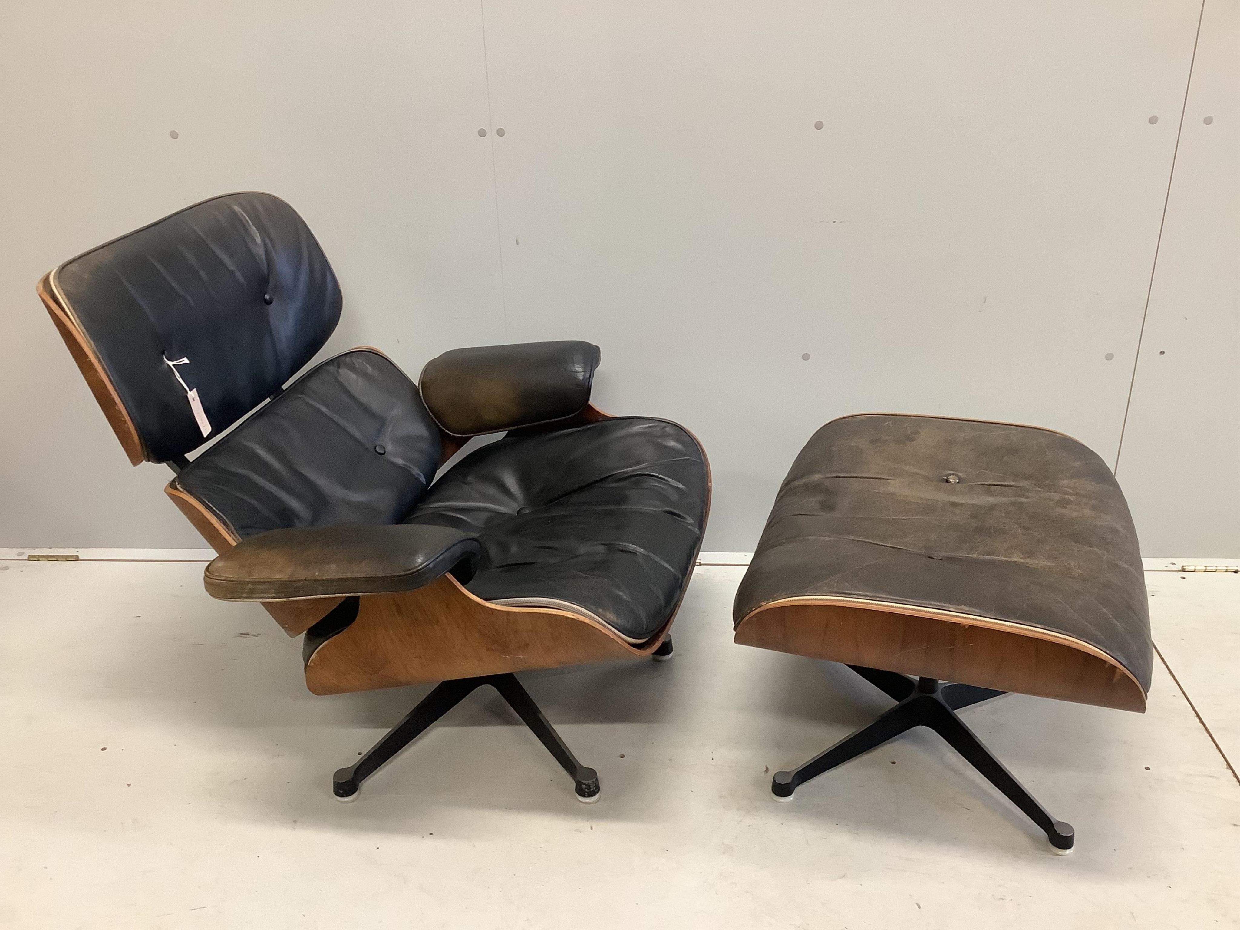 Charles and Ray Eames for Herman Miller Interform, an Indian rosewood and black leather lounge chair and ottoman, circa 1960, chair width 85cm, depth 68cm, height 81cm. Condition - poor to fair